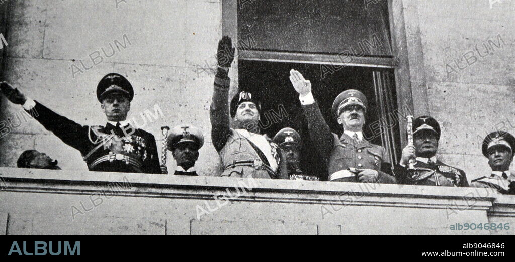 Black and white photograph of Adolf Hitler and Benito Mussolini on a balcony saluting a crowd after the signing of the Pact of Steel forming their alliance, 22 May 1938.