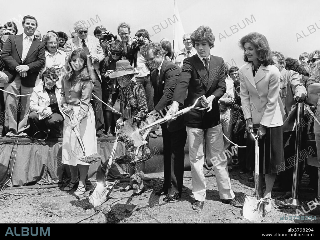Members of the Kennedy family, (Caroline, Rose, Ted, John Jr., and Jacqueline Kennedy Onassis), break ground for the JFK Presidential Library in Boston, MA; 1977.
