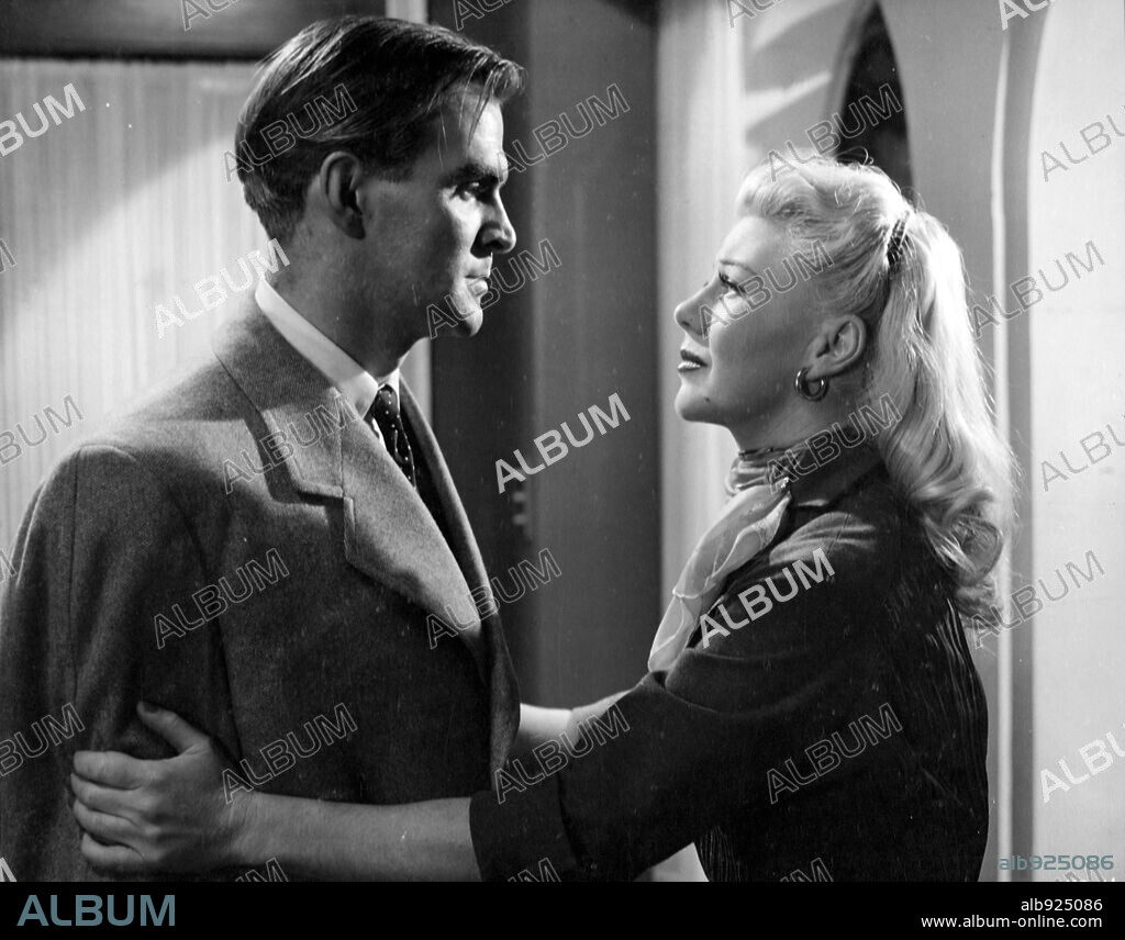 GINGER ROGERS and STANLEY BAKER in TWIST OF FATE, 1954 (BEAUTIFUL STRANGER), directed by DAVID MILLER. Copyright BRITISH LION.