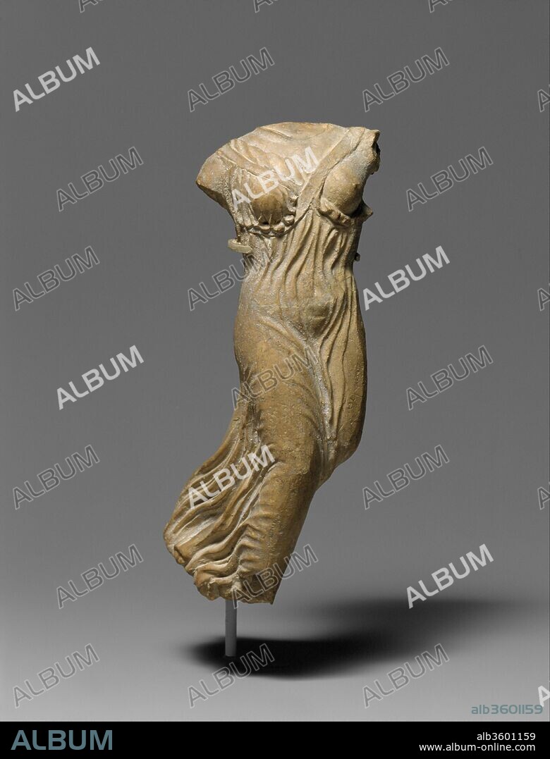 Terracotta statuette of Nike, the personification of victory. Culture: Greek. Dimensions: Overall: 7 x 2 7/8 x 2 3/4 in. (17.8 x 7.3 x 7 cm). Date: late 5th century B.C..
Three-dimensional representations of Nike, the winged goddess who brought victory in both battle and athletic contests, usually attempt to evoke flight or the moment of alighting.  This flying figure once had wings attached to the slots in the back.