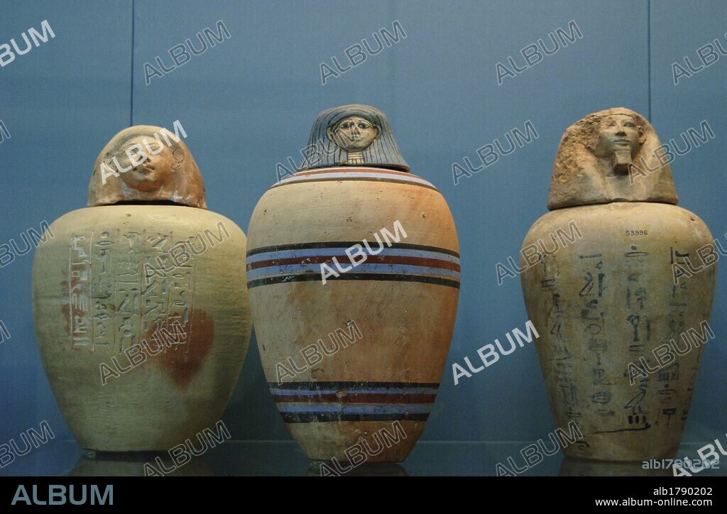 Polychormed canopic jars. Used by the egyptians during the mummification to preserve the viscera. On the left, painted jar of a child of the Royal Nursery of Ahmose. 1500 BC. From Upper Egypt. In the center, painted jar without inscription. 1450 BC. On the right, jar with hieroglyphic text. 1500 BC. Unknown origin. British Museum. London. United Kingdom.