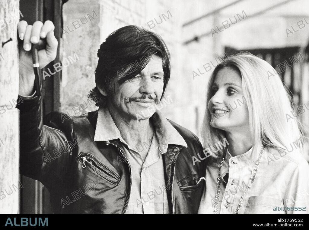 Charles Bronson with his wife Jill Ireland. American actor Charles Bronson with the English actress Jill Ireland, his wife. Naples, 1972.