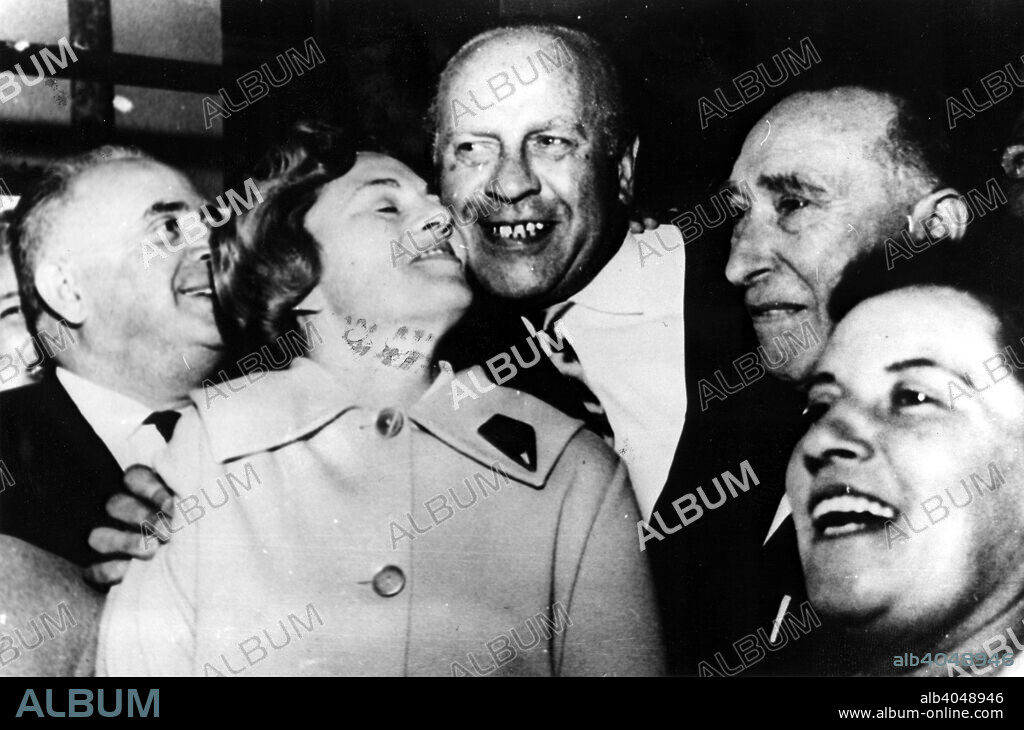 Oscar Schindler (1908-1978), German businessman who saved over 1000 Jews from gas chambers during World War II. With survivors in Tel-Aviv. His right hand man, Isaac Stern is on the right.