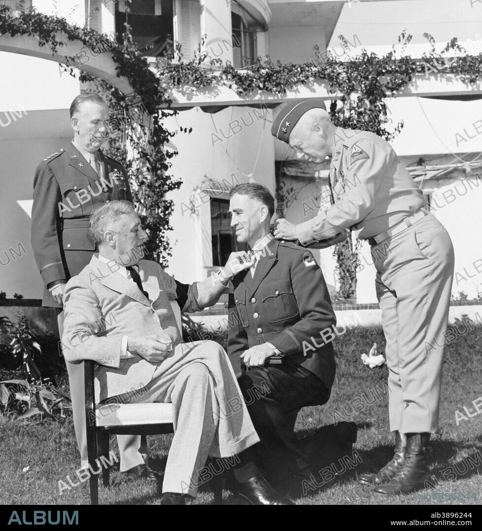 Vintage World War II photo of President Franklin Delano Roosevelt presenting the Medal of Honor, to General William Wilbur, as Generals George Marshall and George Patton look on. The event took place in Casablanca on January 22, 1943.
