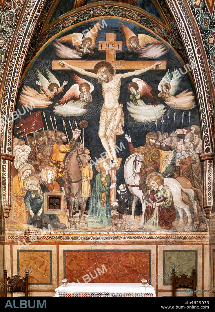 Montefalco, Church of St. Claire, Chapel of St. Claire: "Crucifixion", painted in 1333 by the first Master of St. Clare of Montefalco. The painting is based on the gospels of Luke and John. In the lower right corner the kneeling client, Jean D'Amiel, rector of the Duchy of Spoleto, sad St. John the Evangelist and a centurion. On the left the suffering Madonna and, at the feet of the Cross, Magdalene.