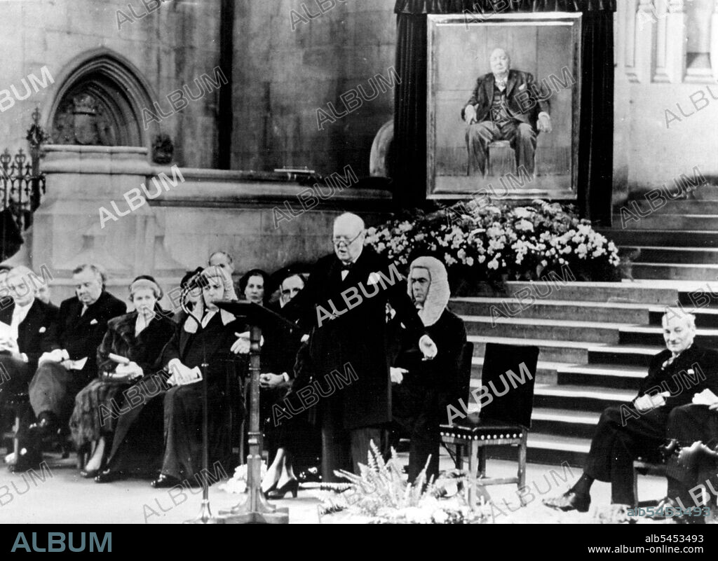 Prime Minister Celebrates His 80th Birthday -- Sir Winston Churchill speaking after the presentations in Westminster Hall.L to R: Sir Anthony Eden, Foreign Minister: Mr. McLeavy, M.P.: Mrs. Attlee, wife of Mr. C.R. Attlee, Leader of the Opposition: Behind Sir Winston are Lady Churchill and Mr. W.S. Morrison, Speaker of the House of Commons.At a ceremony held in the ancient Westminster Hall the Prime Minister Sir Winston Churchill was presented with an oil painting of himself and also a bound volume holding the signatures and good wishes of almost all the Members of both Houses of Parliament a tribute to him on his 80th birthday. November 30, 1954. (Photo by Sport & General Press Agency Limited).