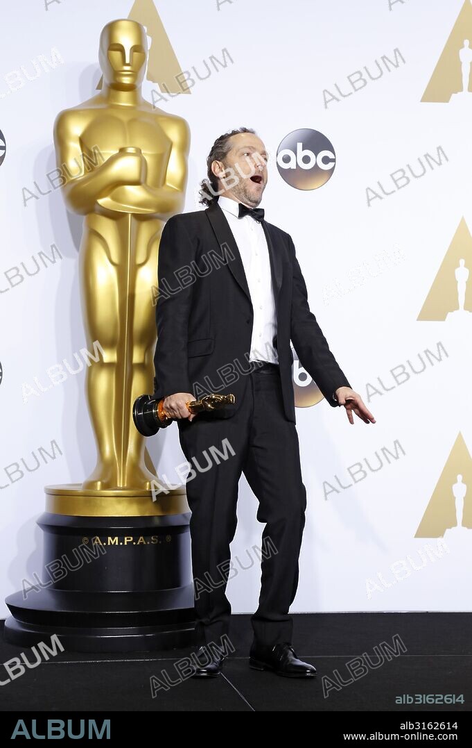 EMMANUEL LUBEZKI. February 28, 2016 - Hollywood, California, USA - Cinematographer Emmanuel Lubezki, winner of the Best Cinematography award for 'The Revenant', poses in the press room during the 88th Annual Academy Awards at Loews Hollywood Hotel on February 28, 2016 in Hollywood, California. 28/02/2016