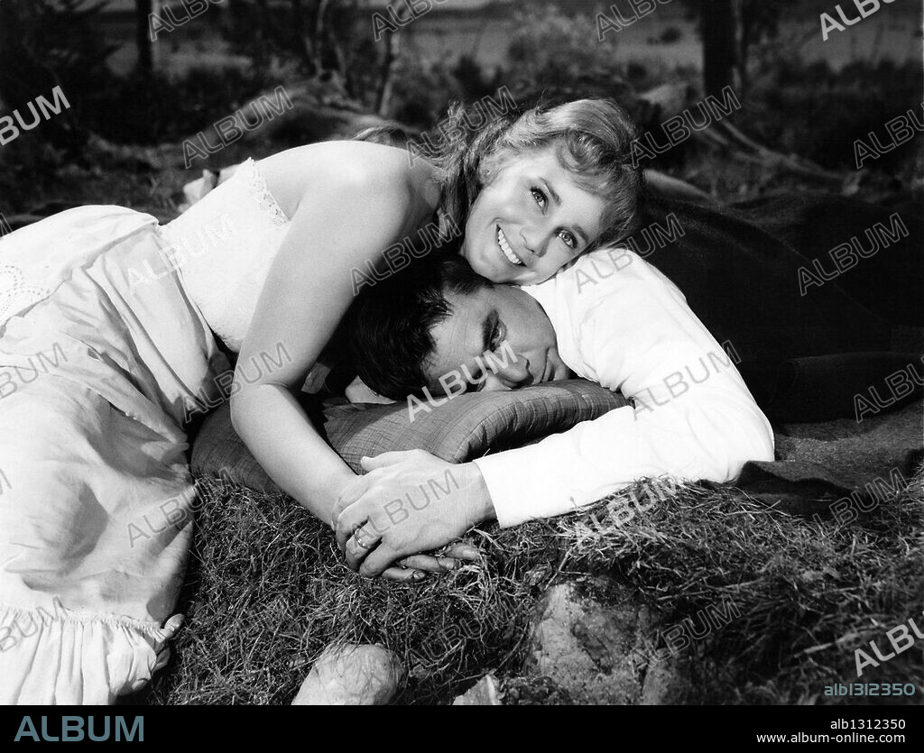 GLENN FORD and MARIA SCHELL in CIMARRON, 1960, directed by ANTHONY MANN. Copyright M.G.M.