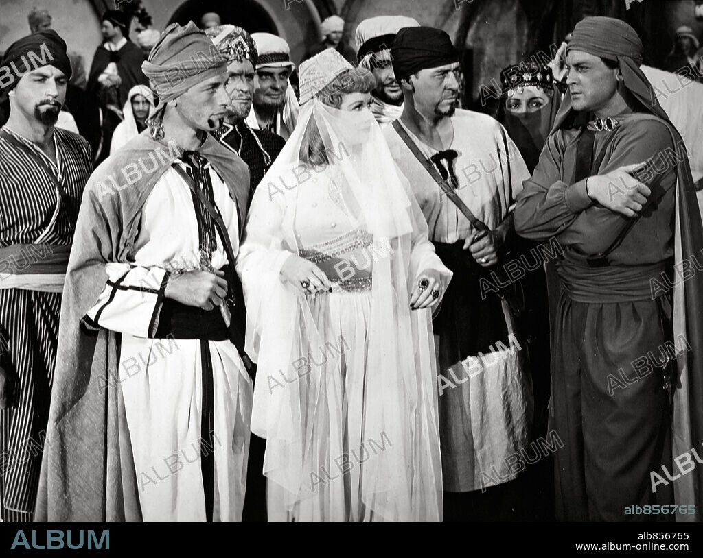 JOHN AGAR y LUCILLE BALL en LA ALFOMBRA MÁGICA, 1951 (MAGIC CARPET), dirigida por LEW LANDERS. Copyright COLUMBIA PICTURES.