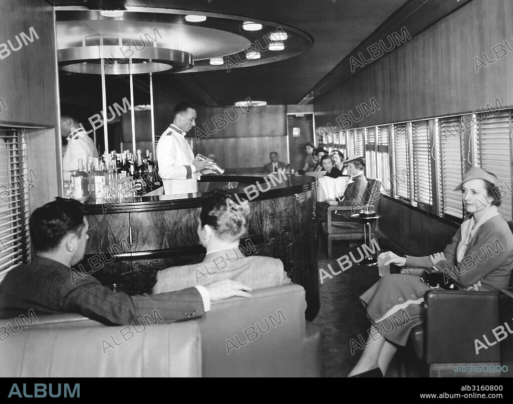 Detroit, Michigan: 1936. The interior of the lounge car on the New York Central Railroad's new streamlined Mercury train. The train was designed by noted industrial designer Henry Dreyfuss and operates between Cleveland and Detroit.