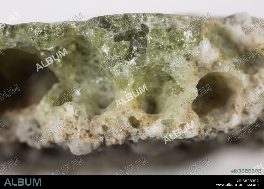 Trinitite, also known as atomsite or Alamogordo glass, is the glassy residue left on the desert floor after the plutonium-based Trinity nuclear bomb test on July 16, 1945, near Alamogordo, New Mexico. The glass is primarily composed of arkosic sand composed of quartz grains and feldspar that was melted by the atomic blast. Trinitite is mildly radioactive but is safe to handle for short periods of time.