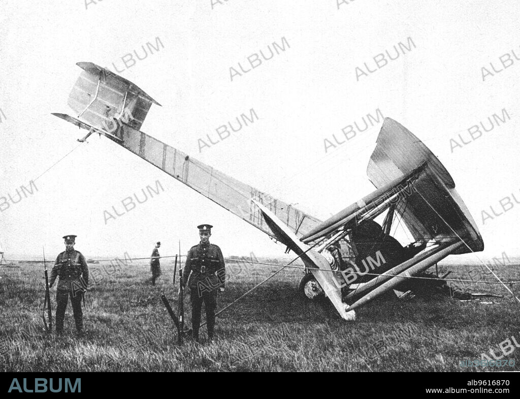 Alcock and Brown's aeroplane after completing the first non-stop transatlantic flight, 1919. British aviators John William Alcock (1892-1919) and Arthur Whitten Brown (1886-1948) flew a Vickers-Vimy-Rolls bomber between St John's in Newfoundland, Canada and Clifden in County Galway, Ireland on 14-15 June 1919. The flight took 16 hours and 27 minutes and won the aviators a £10,000 prize awarded by the Daily Mail newspaper. The aircraft is seen where it crash-landed, in Derrygimla bog near Clifden, being guarded by British troops.