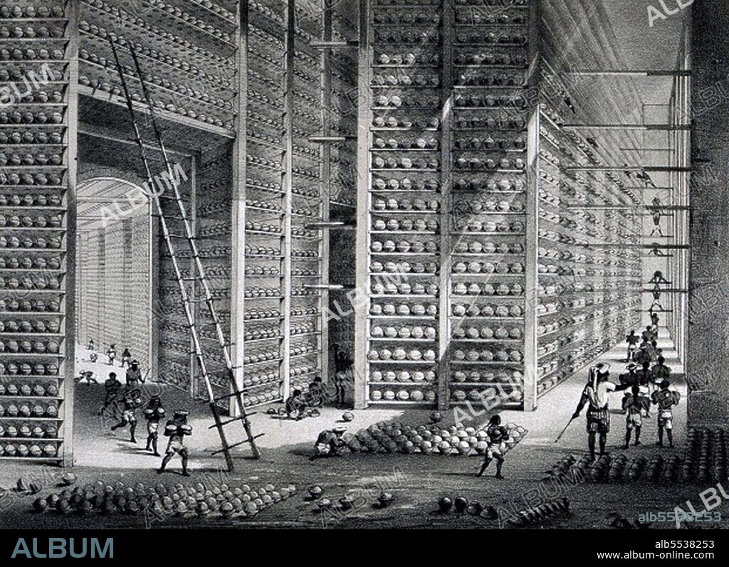 The finished opium balls are stored before shipping in the Stacking Room, where 'a number of boys are constantly engaged in stacking, turning, airing, and examining the balls. To clear them of mildew, moths or insects, they are rubbed with dried and crushed poppy petal dust'. Finally, the balls are transferred into cardboard boxes and loaded into ships bound for Calcutta and, ultimately, China.