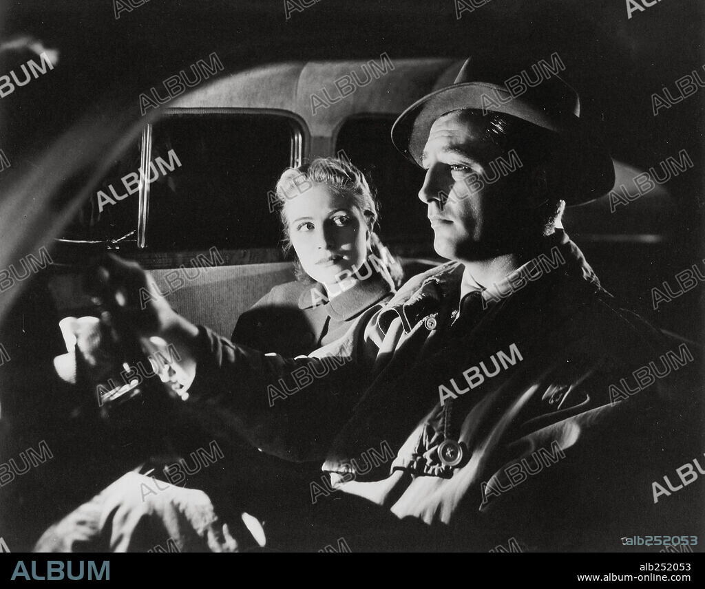 RHONDA FLEMING and ROBERT MITCHUM in OUT OF THE PAST, 1947, directed by JACQUES TOURNEUR. Copyright RKO RADIO PICTURES.