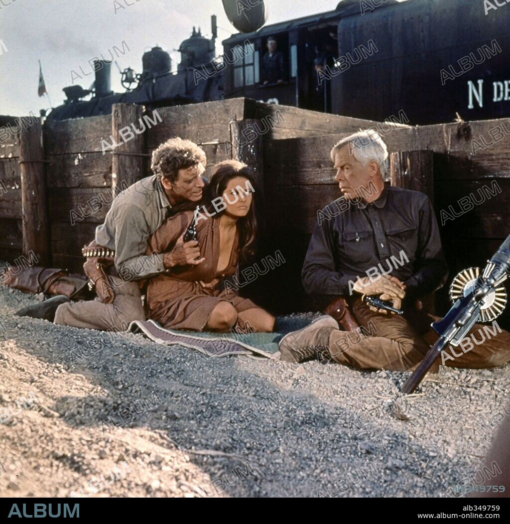 BURT LANCASTER, CLAUDIA CARDINALE and LEE MARVIN in THE PROFESSIONALS, 1966, directed by RICHARD BROOKS. Copyright COLUMBIA PICTURES.