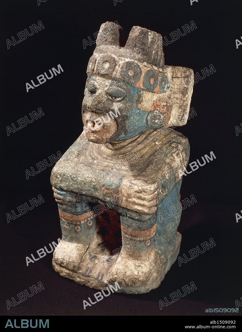 Aztec civilization, Mexico, 15th century. Painted stone statue of seated god Nappatecuhtli.