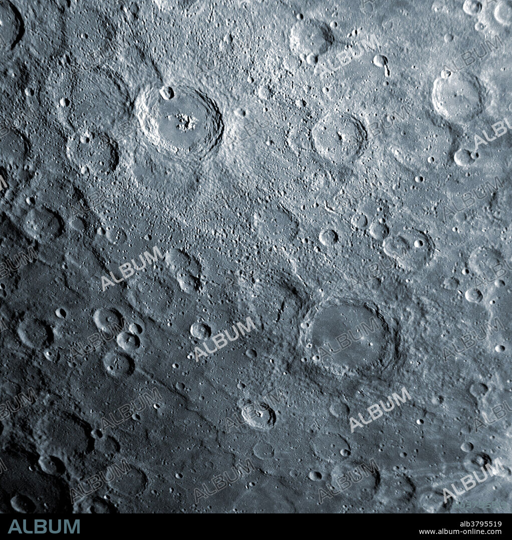 The surface of the planet Mercury. Near the top center of this image is the crater Amaral, recently named for the Brazilian modernist painter Tarsila do Amaral, who lived from 1886 to 1973. Amaral crater, with its smooth floor, surrounding ejecta, and small secondary craters, appears noticeably younger than the heavily cratered surface around it. Along with a smooth crater floor, Amaral also has a central peak. Bright material on this peak is of particular interest to members of the MESSENGER Science Team, as it appears to have an unusual color in images acquired in the 11 color filters of the Wide Angle Camera (WAC). Color enhanced version of BM4384.