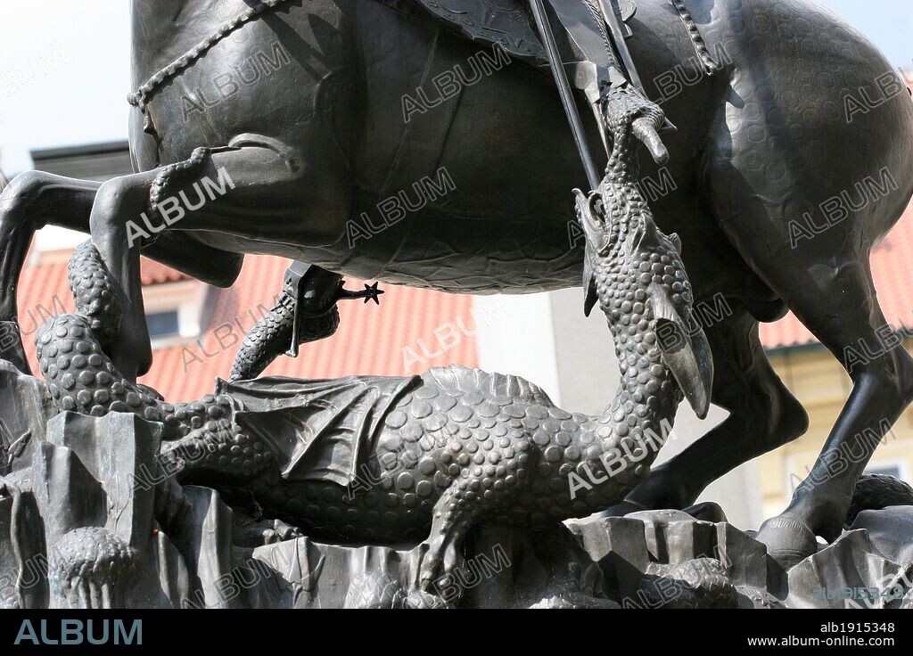St.George killing a dragon. Detail. Gothic bronze statue, unique example of metal casting in 14th century. It was cast by George Martin and Kluj in 1373. The original statue is stored in the collections of the National Gallery and the actual is a copy from 1967. Prague Castle,Third Courtyard. Czech Republic.