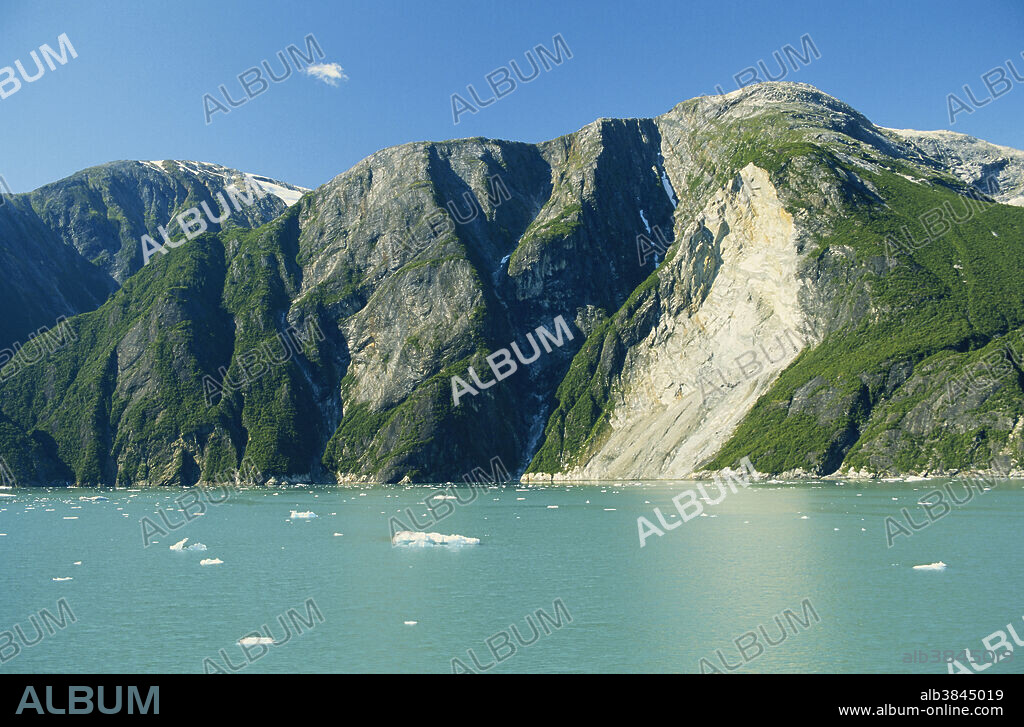 Fjords are formed by glaciers carving through valleys and over-deeping them to below sea level. The result is a long sea inlet surrounded by steep rock walls. This is the Tracy Arm Fjord in Alaska.