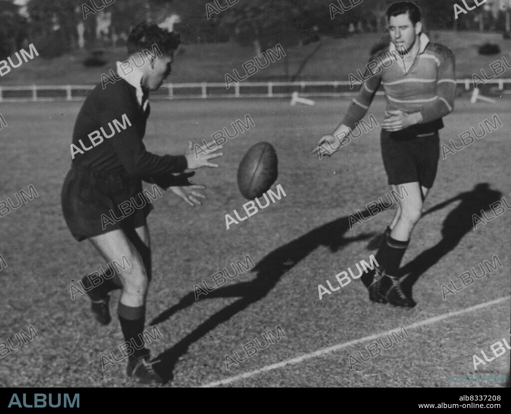 Forwards Combine:- NSW Rugby US Arthur Buchan (left), about to take a pass man, Phil Hardcastle,during training for today Queensland. July 27, 1946.