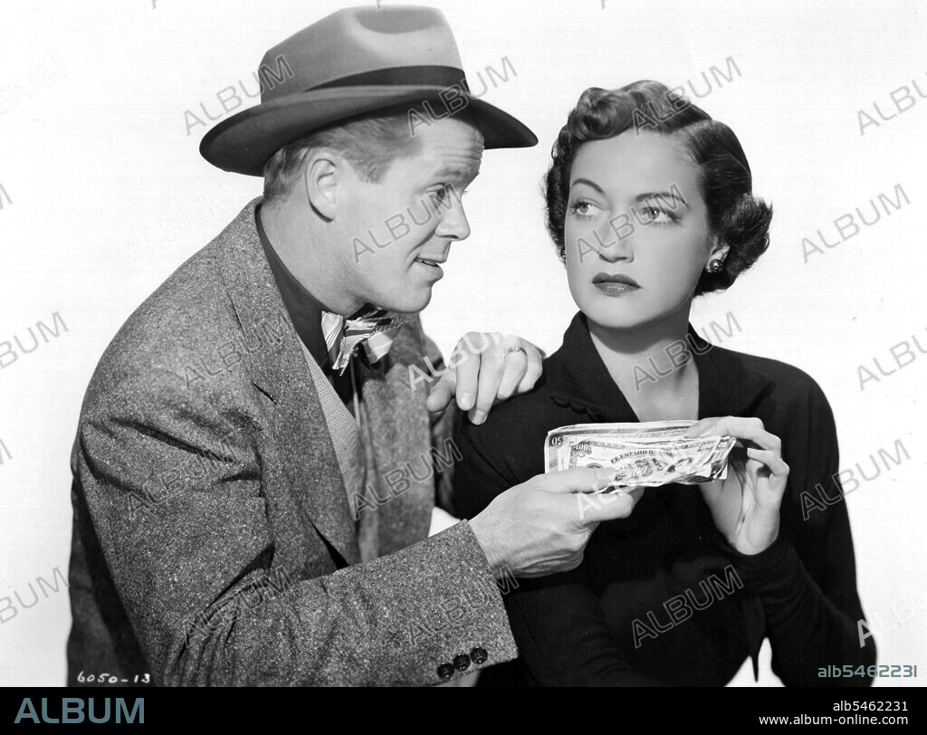 DAN DURYEA and DOROTHY LAMOUR in MANHANDLED, 1949, directed by LEWIS R. FOSTER. Copyright PARAMOUNT PICTURES.