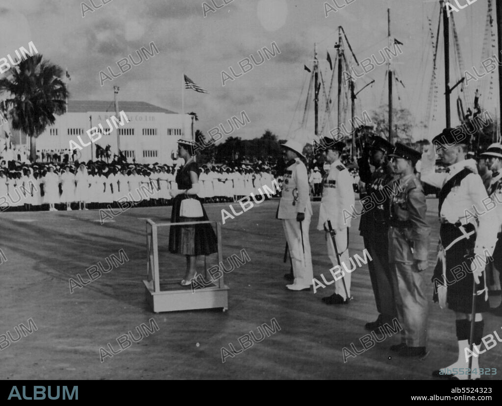 Princess Margaret's Tour of the Caribbean -- Before leaving for Antigua in the Leeward Islands her Royal Highness Princess Margaret takes the salute at a parade prior to departure from Barbados. February 15, 1955. (Photo by London Express News And Features Services).
