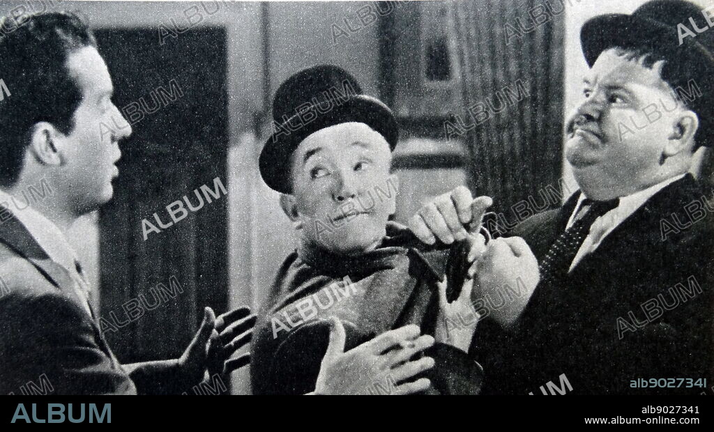 Film still of Oliver Hardy (1892-1957) and Stan Laurel (1890-1965) from 'The Dancing Master'.