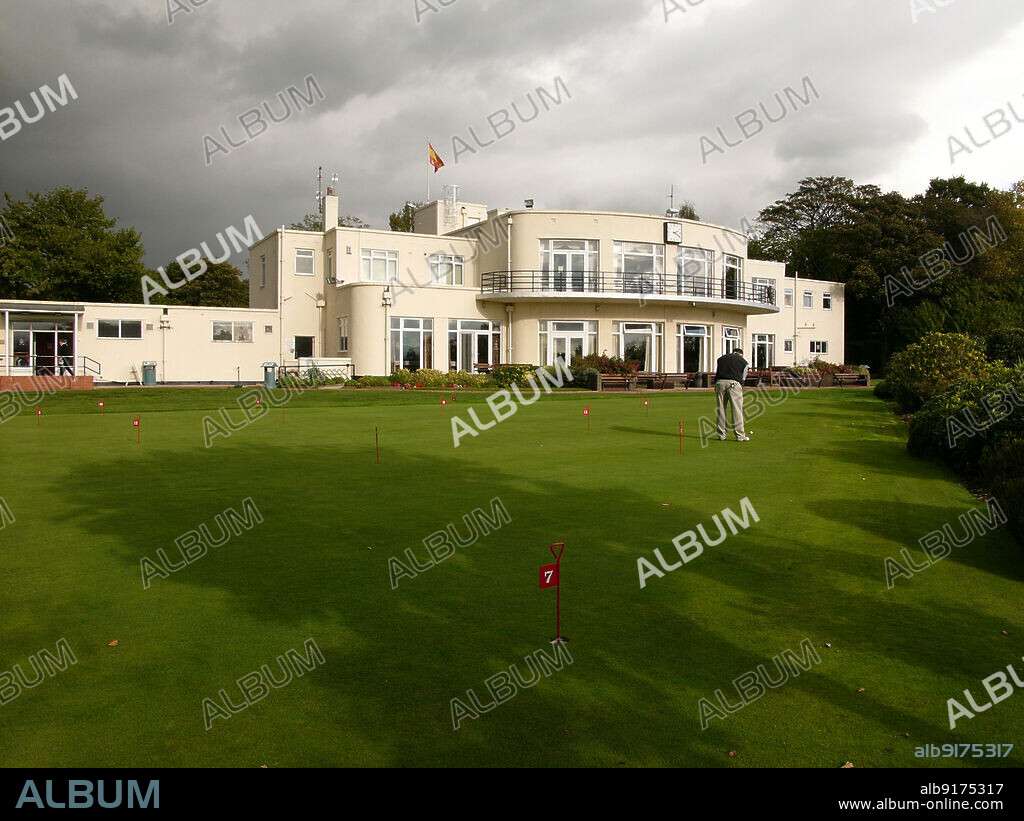 SIMON INGLIS. Childwall Golf Club, Naylor's Road, Liverpool, 2006. The Art Deco clubhouse of Childwall Golf Club, seen from the south-west with a golfer on the practice area in the foreground. Childwall Golf Club was formed in 1912 and moved to Naylor's Road in 1938. The clubhouse was designed by Alfred Shennan, and the course by James Braid.