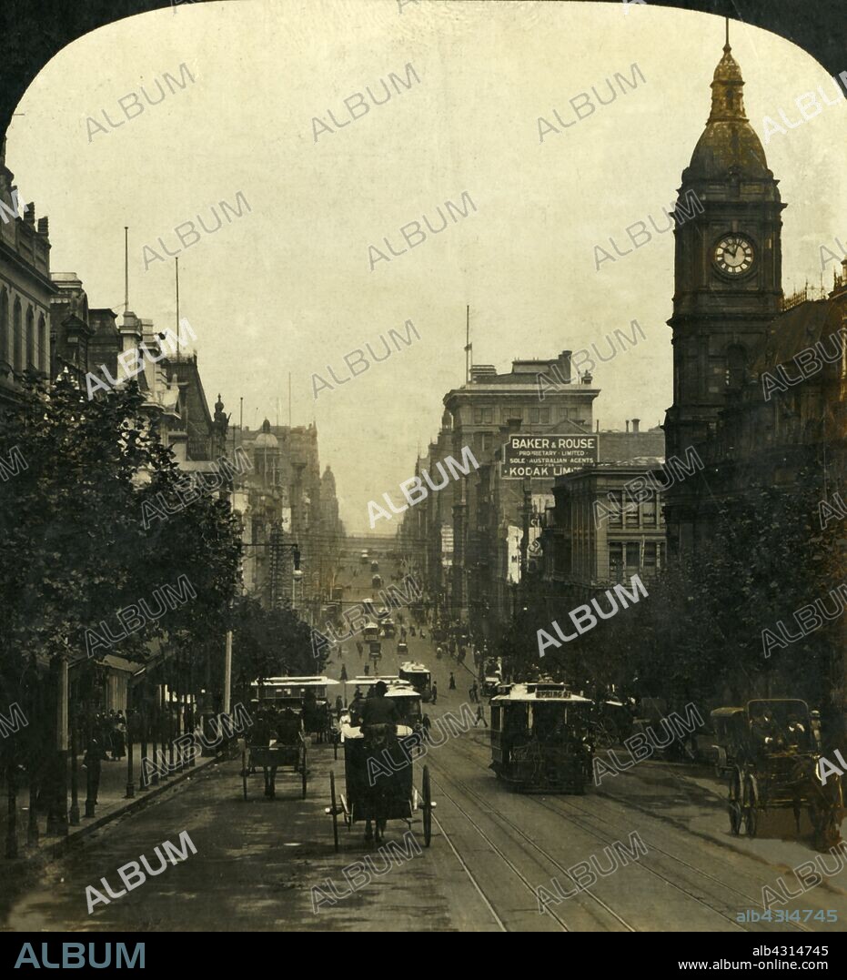 'Cities of the Sunny South, Melbourne, Victoria, Australia', 1909. 'Collins Street from Russell Street looking west, a grand avenue'. Horse-drawn vehicles and trams on one of Melbourne's main thoroughfares, with the Town Hall and Prince Alfred's Tower on the right. One of a set of stereocard views by George Rose, boxed as "Studies through the Stereoscope", to be viewed on a Sun Sculpture stereoscope made by Underwood & Underwood. [The Rose Stereograph Company, Melbourne, Sydney, Wellington & London, c1909].