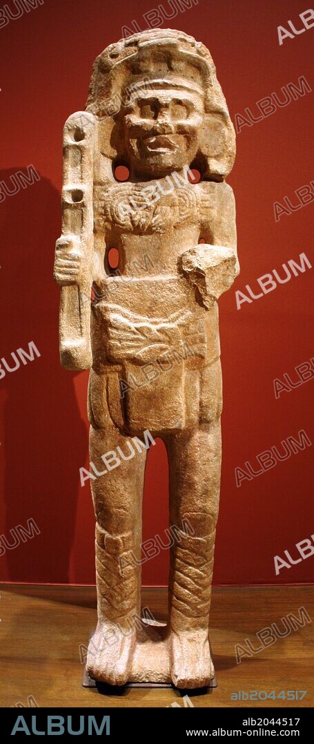 Maya Deity. 9th century, limestone. This towering sculpture of the Maya god Chahk - an able warrior and an embodiment of rain, thunder and lightening - guarded a royal building. His multiple roles are indicated by the axe he raises menacingly in his right hand.