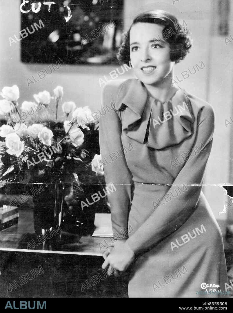 Colleen Moore, popular screen favourite, is seen here *****
May 14, 1934. afternoon frock of beige crepe with several high-fashion *****, notably the wind-blown collar treatment and the *****.
Miss Moore's latest production is the New Columbia picture, "Social Register" which is to be distributed throughout Australia and New Zealand by Greater Australsian Films Ltd. May 14, 1934.