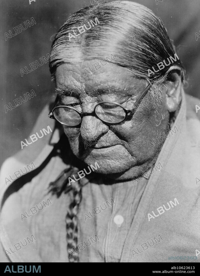 EDWARD SHERIFF CURTIS. Henry-Wichita, c1927. Henry, a Wichita Indian man, head-and-shoulders portrait, facing slightly left, looking down.