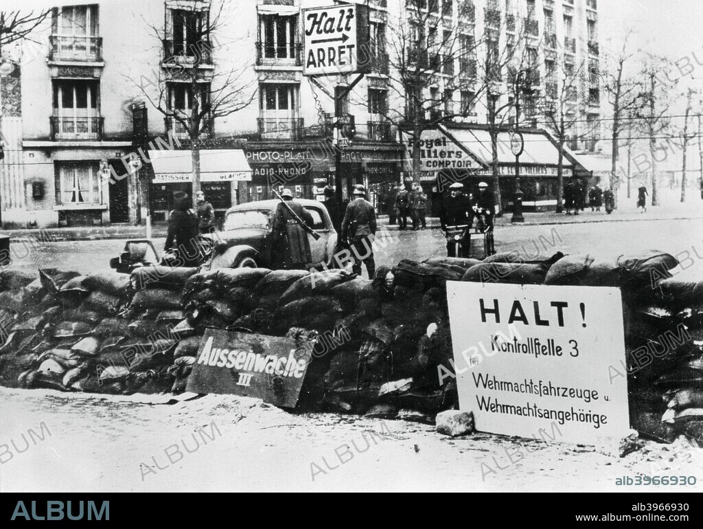 German checkpoint, occupied Paris, 1940-1944. During the occupation the freedom of movement of the citizens of Paris was restricted as they were subjected to checks of their vehicles and papers.