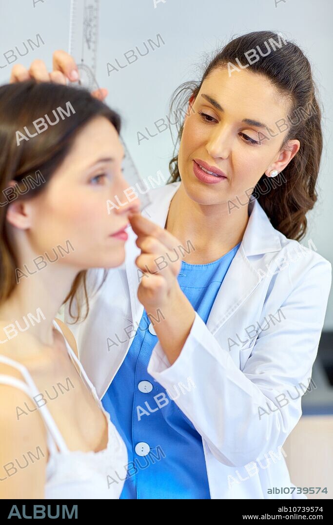 Nose. Rhinoplasty. Perfiloplastia. surgery that focuses on changing the nasal aesthetics. There is a consensus measures and nasal angles to consider a nose presents an aesthetic harmony. Plastic surgery. Doctor attending to patient medical consultation.