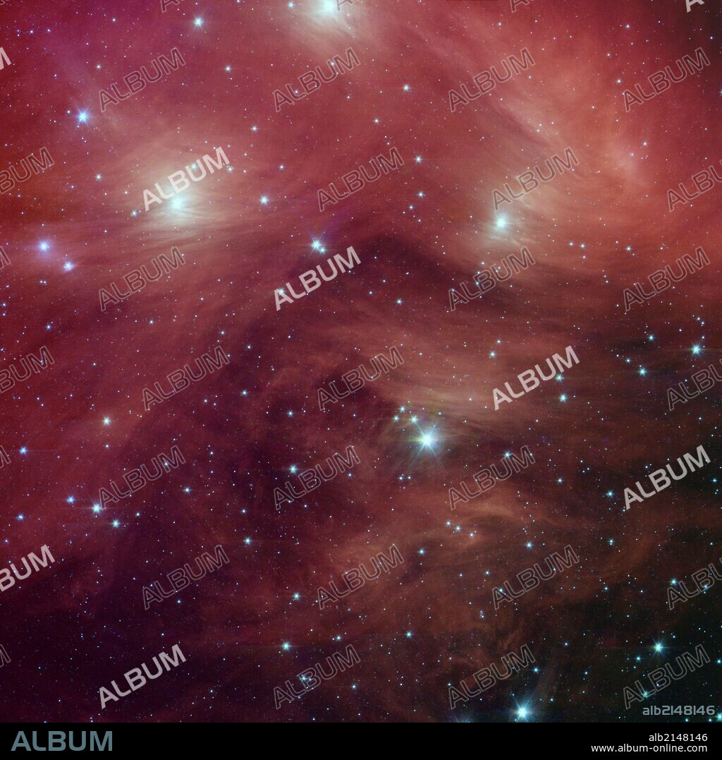 The Seven Sisters, also known as the Pleiades star cluster, located more than 400 light-years away in the Taurus constellation. Spitzer Space Telescope. (Photo by: Universal History Archive/UIG via Getty Images).