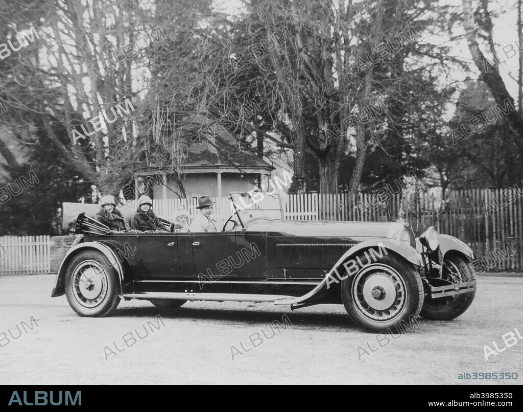 Bugatti Royale, (1920s?). An example of the type 41 in the original body before rebodying in Weymann style. Two elegant women in cloche hats and fur coats sit in the back. The Royales are regarded by many collectors as the finest example of Ettore Bugatti's work. Powered by a massive 12760cc engine, only a handful were ever made.