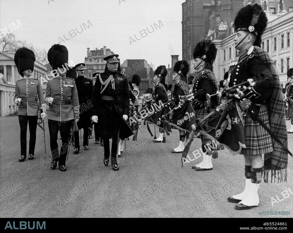 Royal Inspection -- The Duke of Gloucester inspecting the piper of the Scots Guards on the Parade Ground Today.The Duke of Gloucester paid his Annual visit of inspection to the 1st Battalion Scots Guards , At Wellington Barracks today... The Duke is Colonel of the Regiment. April 27, 1955. (Photo by Paul Popper, Paul Popper Ltd.).