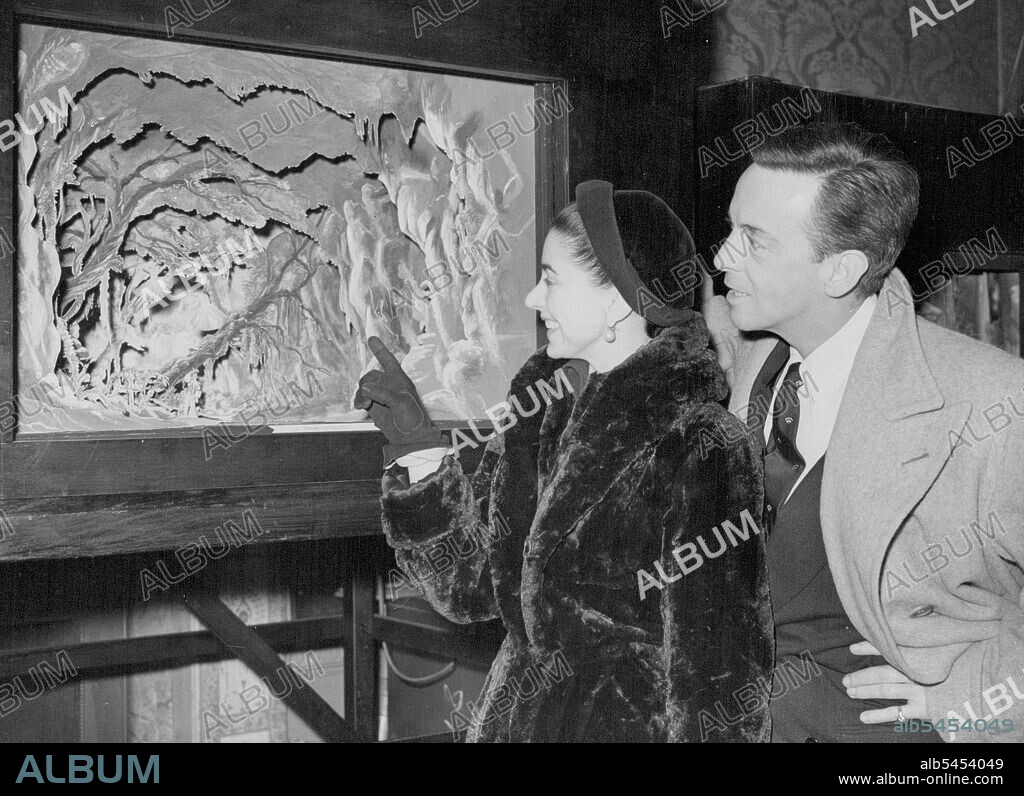 Ballet Exhibition For Spain And Portugal. Helpmann and Fonteyn At Private View. Sadlers Wells' ballet dancers Miss Margot Fonteyn and Robert Helpmann looking at a model of a scene from "Giselle" when they attended a Private View of a British Council exhibition of British Ballet, which on April goes on show at Madrid, Barcelona, and probably Bilbao. Later in the year the exhibition will be seen in Lisbon. The exhibition includes scale models of stage sets, original costume and set designs and photographs, books on ballet, and musical scores.Helpmann and Fonteyn, who recently toured American with Sadlers Wells, will be appearing in "Giselle" at the Covent Garden Opera House on 6th March. March 03, 1950.