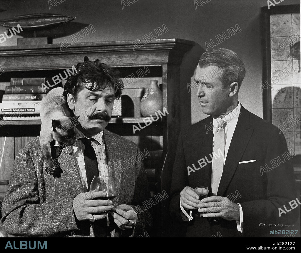 ERNIE KOVACS and JAMES STEWART in BELL BOOK AND CANDLE, 1958, directed by RICHARD QUINE. Copyright COLUMBIA PICTURES.