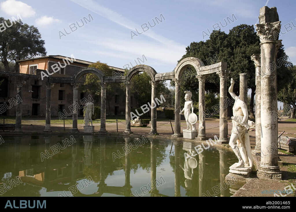 Hadrian's Villa (Italian: Villa Adriana), was the luxurious retreat of Emperor Hadrian in Tibur (modern Tivoli). It was one of the most magnificent villas in the ancient world. It was built in the 2nd century AD as a home for the emperor and his court. During the later years of his reign, he actually governed the empire from the villa. The villa shows echoes of many different architectural orders, mostly Greek and Egyptian. The large Canopus pool (119 x 18 meters) was named after the canal that linked Alexandria with Canopus on the Nile delta.  The statues that embellish the mixed architecture at the end of the semicircular Euripus at the northern end of the pool are Roman copies of Classical Greek original statues, larger than life size. They represent a young warrior wearing a tall helmet, the so-called "Ares" but actually Hermes, and two wounded Amazons, reproductions of the prototypes created by Polyclitus and Phidias for the Temple of Artemis at Ephesus.