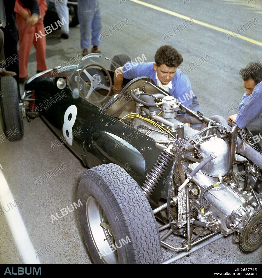 Chief Mechanic Phil Ayliffe working on the works BRM P48 2.5-litre F1 car driven by Bonnier. The pits at Reims, French GP, France 3 July 1960.