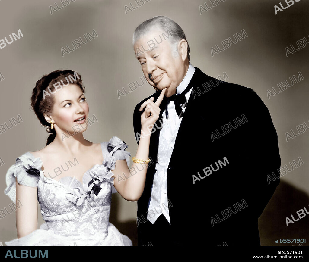 CHARLES COBURN and YVONNE DE CARLO in THE GAL WHO TOOK THE WEST, 1949, directed by FREDERICK DE CORDOVA. Copyright Universal International Pictures (UI).