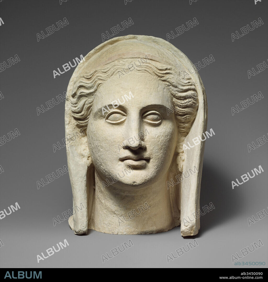 Limestone head of a veiled female votary, Late Hellenistic or Republican, 1st half of 2nd century B.C., Cypriot, Limestone, Overall: 10 3/4 x 10 1/2 x 11 in. (27.3 x 26.7 x 27.9 cm), Stone Sculpture, Female head with veil, frontlet and earring.