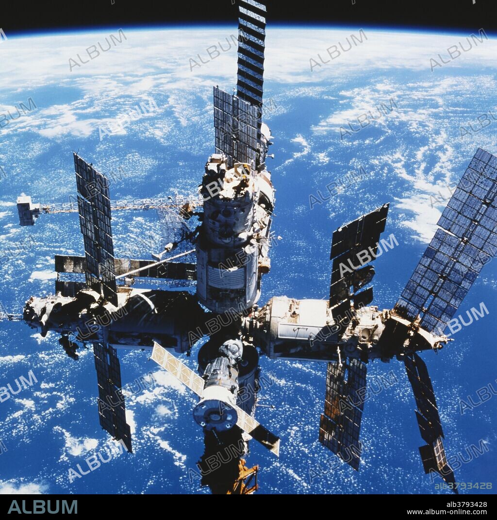 Damaged solar panels, (at lower right), on the Spektr module of the Russian Space Station Mir. On June 25th, 1997, Mir was struck by a Progress unmanned supply vessel. Spektr was punctured near the base of the damaged solar panel, causing it to depressurize. The crew successfully isolated Spektr. Spektr was one of several science modules which were added to Mir since the core of the space station was launched in 1986. This image was taken from the space shutting during mission STS-91, (6/02/98-6/12/98).