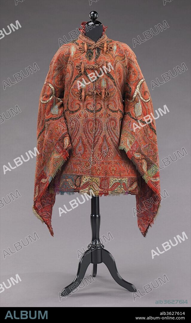 Dolman. Culture: American. Date: ca. 1875.
This dolman is made from a fine quality Indian shawl which is sewn to shape with beautifully symmetrical seaming and a well placed border.  The theme is carried into the interior with an elaborate paisley patterned silk lining making this truly a luxury item. In the 1870s shawls lost popularity due to its immense size and the reducing expanse of skirts to help support them.  Although some were retained as heirlooms, others were stitched into the more wieldy shape of the mantle.