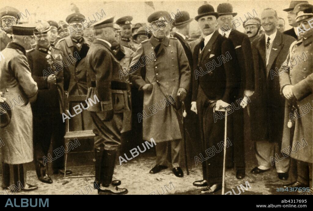 Franz von Papen and Kurt von Schleicher, 1932, (1933). 'Herr Von Papen, the Junker Chancellor of Germany at the crisis...with General Schleicher, his right-hand man, at a review of the "troops" of the Steel Helmets, one of Germany's patriotic organisations'. German Chancellor Franz von Papen (1879-1969) and General von Schleicher (1882-1934) who succeeded him as chancellor. Von Schleicher was in turn succeeded by Adolf Hitler. From "The Pageant of the Century". [Odhams Press Ltd, 1933].