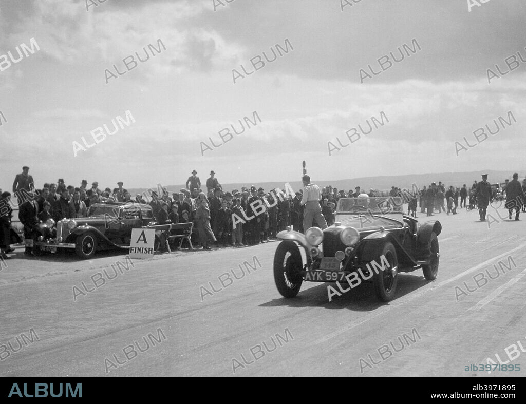 Riley Imp 2-seater, 1934 1089 cc.Reg. No.  AYK597. No: 143. Driver: Champney, Miss. D.C.N.  Left: Rover  Reg. No.  UG5738.  R.S.A.C. Scottish Rally. Date: 10-14.6.34.