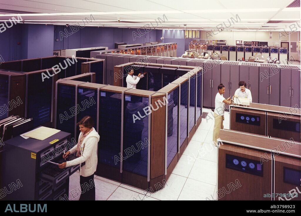 Always eager for better computer simulations, Laboratory weapons designers enthusiastically greeted the arrival of their first CDC 7600 supercomputer in 1969. Nineteen of the first 20 scientific computers purchased by the Laboratory had been from IBM. That string was broken in 1962 when the Lab bought a CDC1604 mainframe from then-upstart Control Data Corporation of Minnesota. A young CDC engineer named Seymour Cray was already at work on an innovative design for a machine 50 times faster than the CDC 1604, and Lawrence Livermore National Laboratory happily acquired one of his CDC 6600 computers for $8 million in August 1964. Cray's design team then further refined this approach, yielding the even larger and faster CDC 7600 in 1969. In the hands of Laboratory users, these machines defined scientific supercomputing for a decade. Their small instruction sets, fast clock speeds, extremely dense custom-soldered circuit boards, and clever use of the machine frame itself for cooling were ideal for nuclear design and plasma simulations. No photographer credited, circa 1970s.