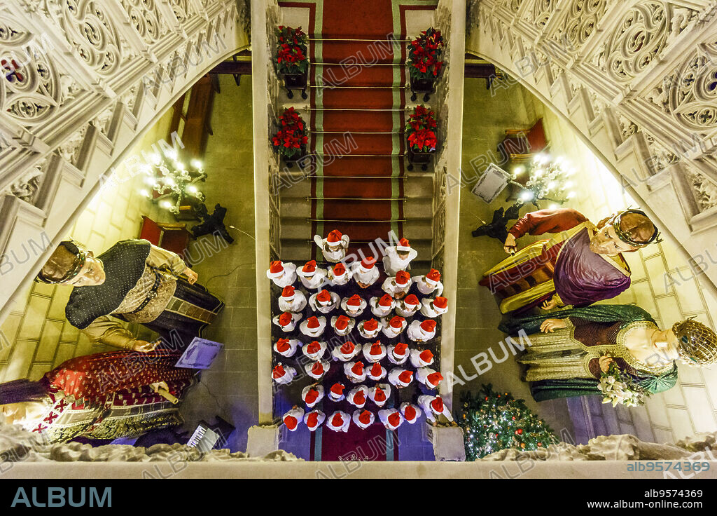 Christmas carol singing by the children's choir of the Teatre Principal de Palma, Palau Reial, 19th-century neo-Gothic, Consell Insular de Mallorca, Palma, Mallorca, Balearic Islands, Spain.