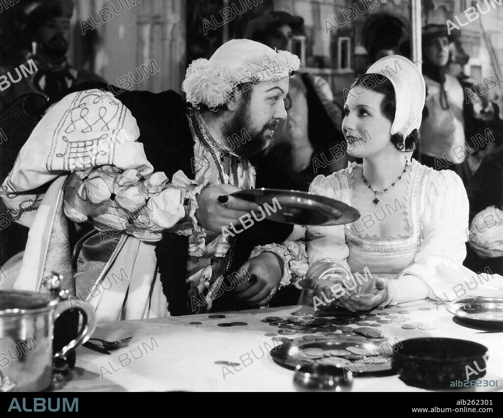 BINNIE BARNES, HEINRICH VIII. VON ENGLAND and CHARLES LAUGHTON. BINNIE BARNES and CHARLES LAUGHTON in THE PRIVATE LIFE OF HENRY VIII, 1933, directed by ALEXANDER KORDA. Copyright UNITED ARTISTS.